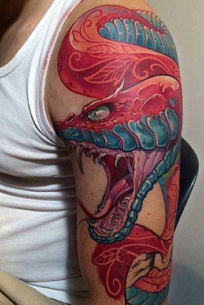 red snake tattoo on arm