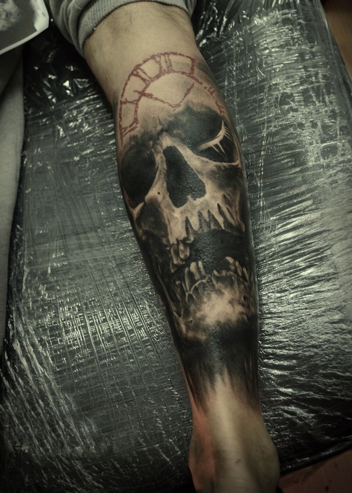 skull tattoo on calf for men
