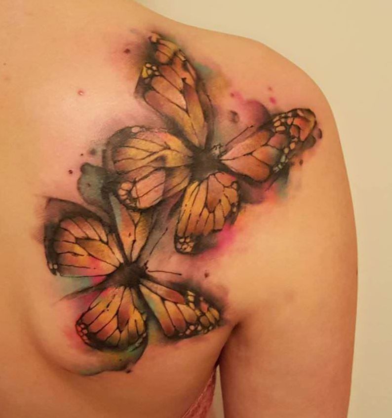 motyle wodne kolory tatuaże