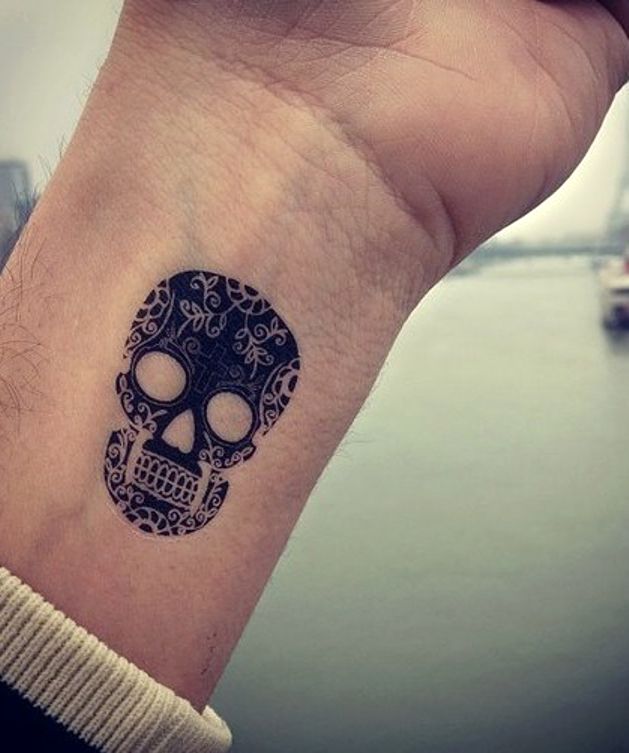small skull tattoo for men