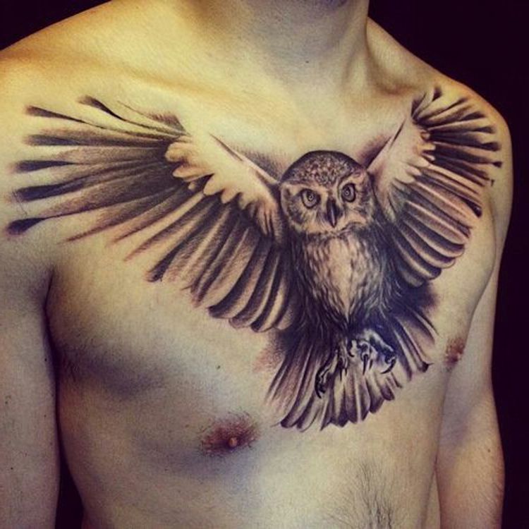 flying owl tattoo on chest