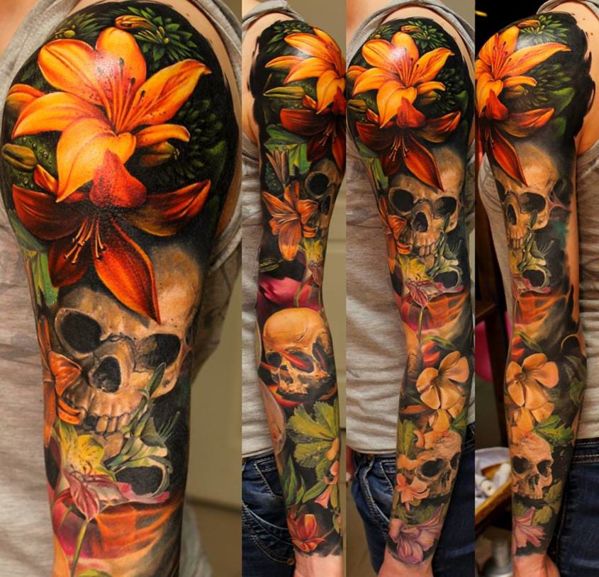 flowers and skull sleeve tattoo