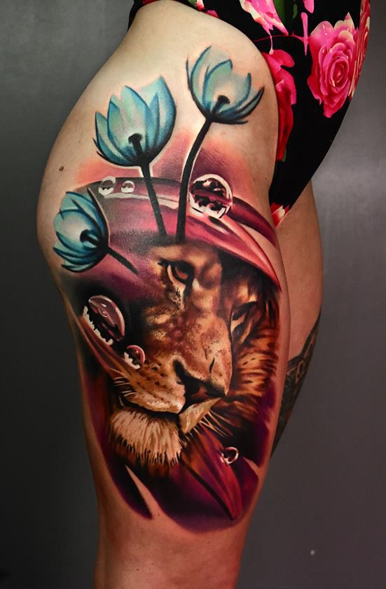 lion and flower tattoo on hips