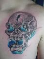 skull chest tattoo