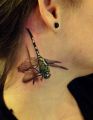dragonfly tattoo on neck