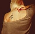 birds tattoos on back for women