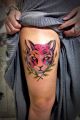 cat tattoo on thigh