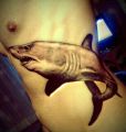 shark tattoo on ribs