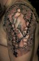 różaniec tatuaż religijny