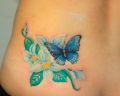 Blue butterfly with flower tattoos