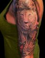 lion tattoo on arm