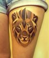 lion tattoo on thigh
