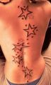 gwiazdy tatuaże na plecach