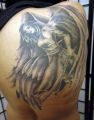 women angel tattoo on back