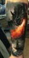 tattoo dragon breathing fire