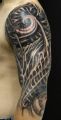 biomechanical arm tattoo
