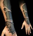ręka gitara tatuaż