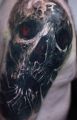 demon skull tattoo on shoulder
