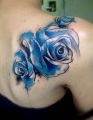 blue flower tattoos on back