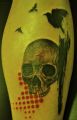 red dot and skull tattoos