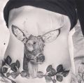 deer tattoo on her belly