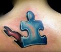 puzzle tattoo on back