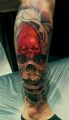red skull in skull tattoo