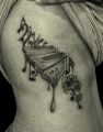 music tattoo design on ribs