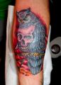 owl on skull tattoo