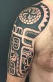 black tribal tattoo on arm