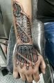 biomechanical wirst tattoo