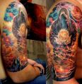 space tattoo on arm