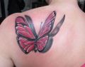 pink butterfly tattoo on back