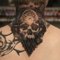 skull and alien tattoo