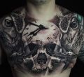 skull and clock tattoo on chest