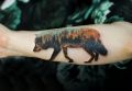 wilk tatuaż las