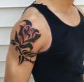 dlack arm rose tattoo