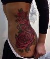 amazing tattoo on ribs and hips | rose
