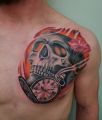 clock and skull tattoo on chest