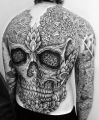 big skull tattoo on back for men