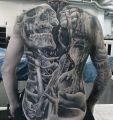 skeleton kiss girl tattoo on back