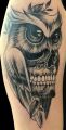 owl skull tattoo on arm