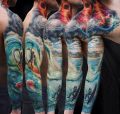 surfing tatuaż na ramieniu