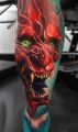 red devil tattoo on calf