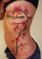 flowers tattoos on ribs