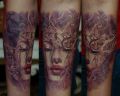 face women tattoo on arm