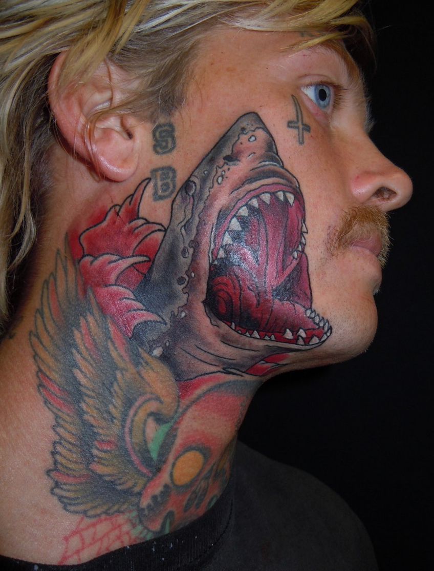 shark tattoo on face