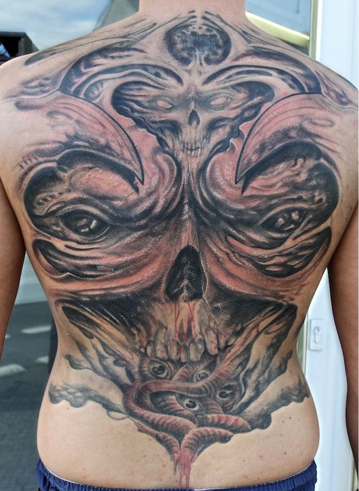 demon skull tattoo on back
