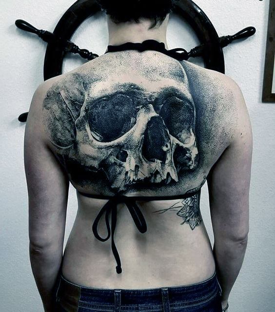 big skull tattoo on back