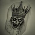 skull in crown tattoo design